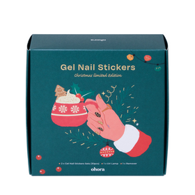 Grøn æske med julemotiv, hånd med negleklistermærker, pynt og tekst: "Gel Nail Stickers".