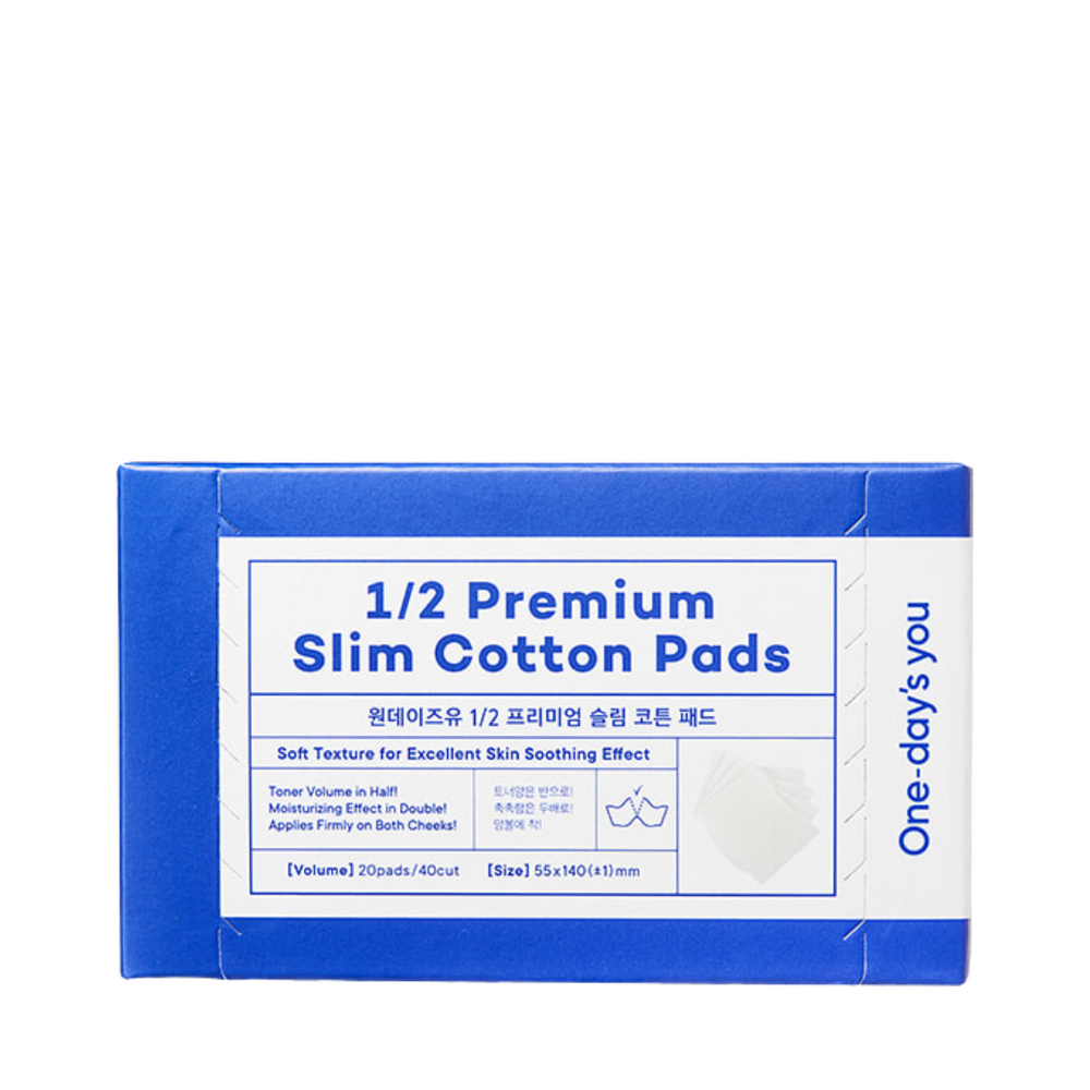 Blå og hvid pakke med teksten "1/2 Premium Slim Cotton Pads" og produktbeskrivelse.