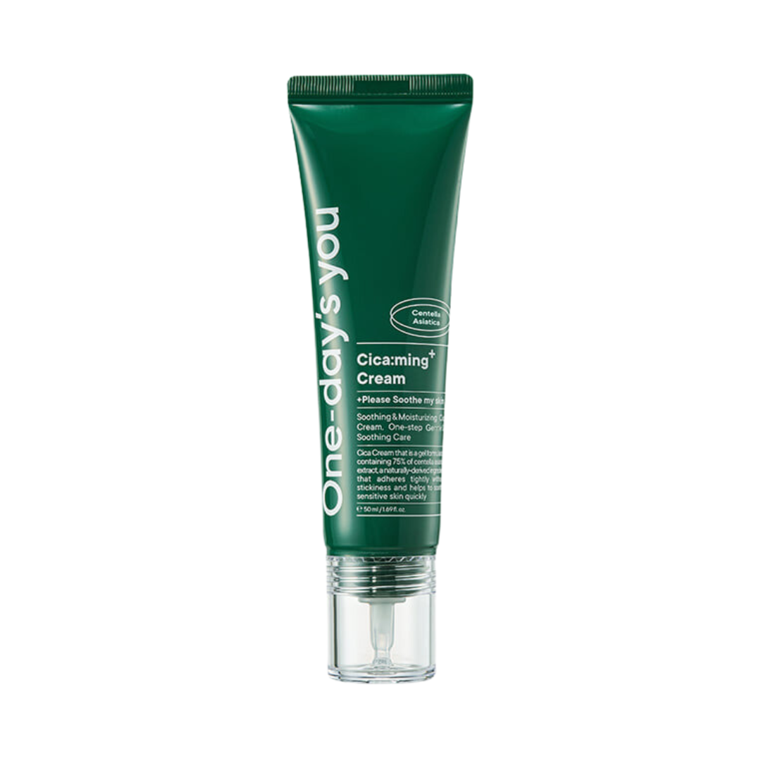 Grøn tube med tekst "One-day's you Cica:ming Cream" og detaljer om beroligende hudpleje.