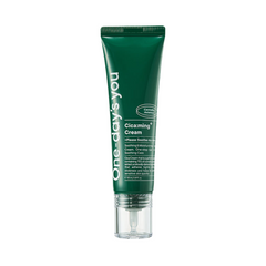 Grøn tube med tekst "One-day's you Cica:ming Cream" og detaljer om beroligende hudpleje.