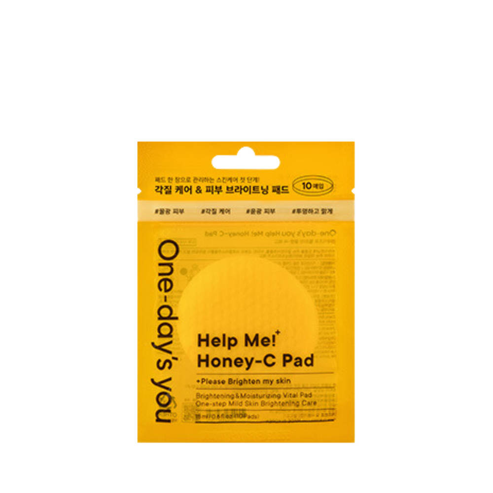 Gul pakke med teksten "Help Me! Honey-C Pad" og mærket "One-day's you".