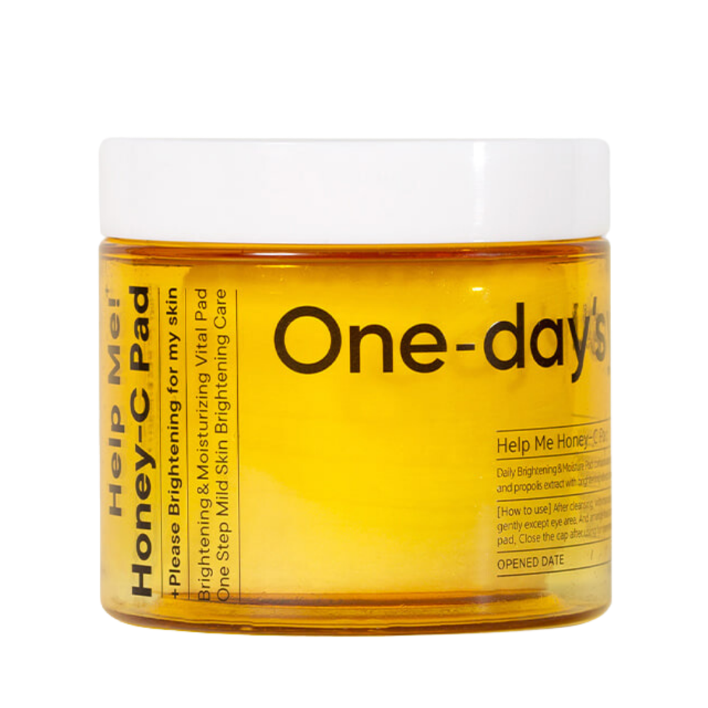 Gul krukke med hvidt låg, mærket "One-day's" og "Help Me! Honey-C Pad."