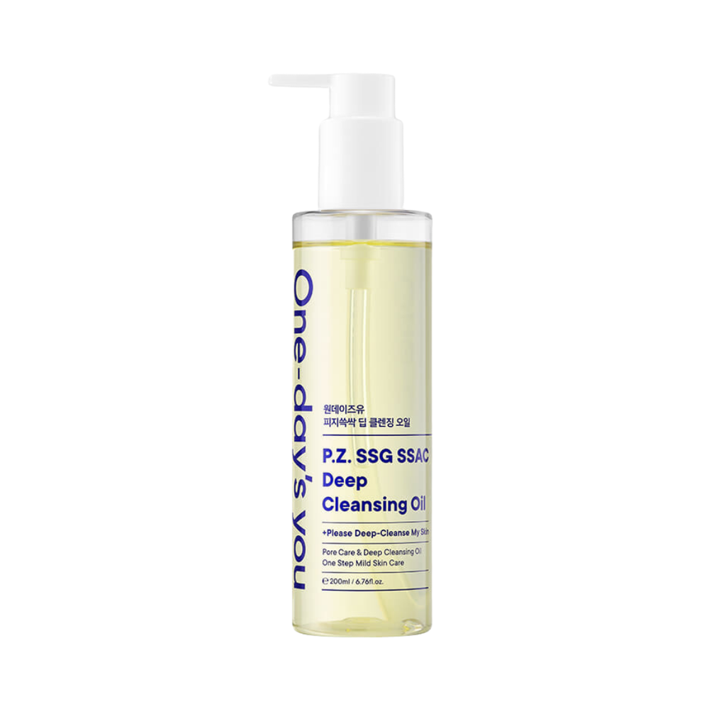 Klar flaske med pumpe, indeholder gullig olie, mærket "One-day's you Deep Cleansing Oil".