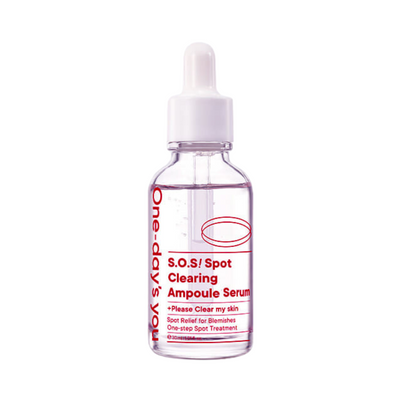 Klar flaske med hvid pipette, rød tekst "One-day's you S.O.S! Spot Clearing Ampoule Serum".