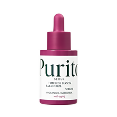 Serumflaske med lilla pipette, hvid etiket med "Purito" og "Timeless Bloom Bakuchiol Serum".