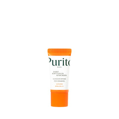 Tuben er hvid med orange låg, mærket "Purito SEOUL Daily Soft Touch Sunscreen SPF50+ PA++++".