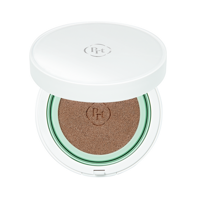 Hvid kompakt med brun BB-cushion, åben så svampen vises. Låg med Pr-t logo på toppen.