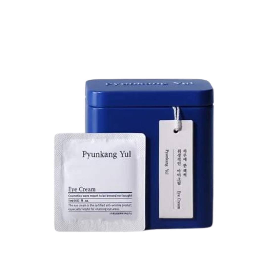 Blå beholder med mærkat og hvid pose mærket "Pyunkang Yul Eye Cream".