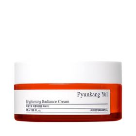 Orange krukke med hvidt låg, mærket "Pyunkang Yul Brightening Radiance Cream", 50 ml.