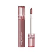 Rom&nd Glasting Color Gloss i farven Dim Mauve med applikator og elegant emballage.