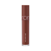 Brun tube med tekst "Zero Velvet Tint", dyb farve, minimalistisk design.