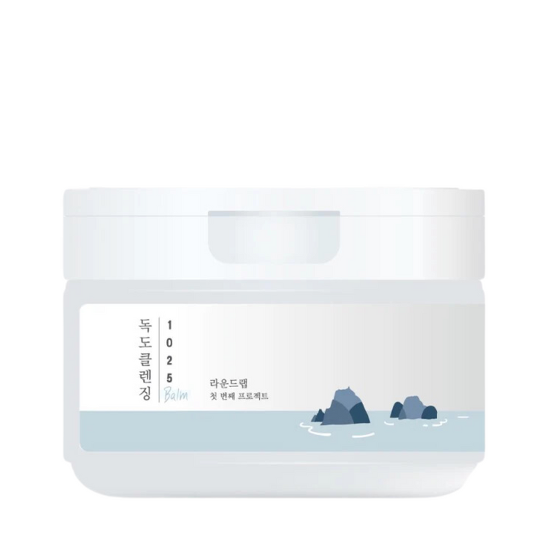 Hvid krukke med koreansk tekst og illustration af klipper i vand. Minimalistisk design.