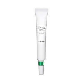 Hvid tube med grøn hætte, mærket "SKIN1004 Madagascar Centella Tea-Trica Spot Cream".