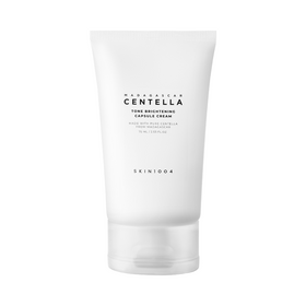 Hvid tube med sort tekst: "Madagascar Centella Tone Brightening Capsule Cream," mærket "SKIN1004".