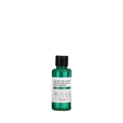 Grøn flaske med sort låg, etiket med tekst om acnebehandling og beroligende egenskaber, 60 ml.