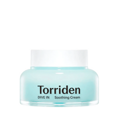 Lys blå krukke med hvidt låg. Tekst: Torriden DIVE IN Soothing Cream.