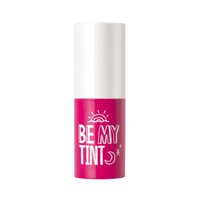 Pink læbe-tint med hvid hætte, tekst "Be My Tint" med sol og måne symboler.