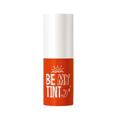 Hvid hætte, orange krop med "Be My Tint" tekst, sol- og måneillustrationer.