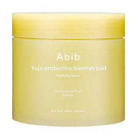 Gul krukke med teksten "Abib Yuja Probiotics Blemish Pad Vitalizing Touch" og produktinfo.