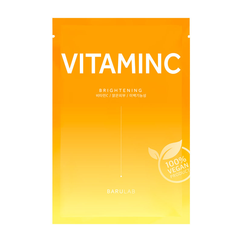 Gult-orange maskeemballage med "Vitamin C", "Brightening" og "100% vegansk produkt" segl.