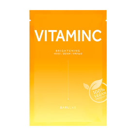 Gult-orange maskeemballage med "Vitamin C", "Brightening" og "100% vegansk produkt" segl.