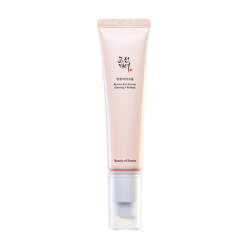 Beige tube med sort tekst: "Revive Eye Serum Ginseng + Retinal". Klar hætte, elegant design.