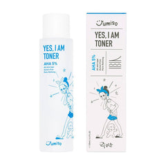 Hvid flaske og æske med Jumiso "Yes I Am Toner AHA 5%" og tegnet figur i blå og sort.