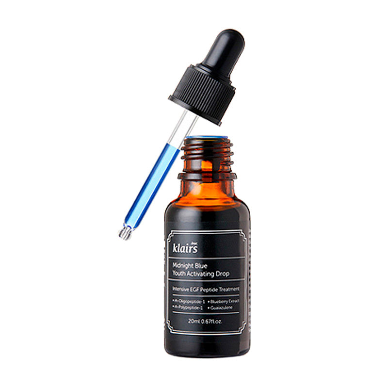 Brun glasflaske med sort etiket, dropper indeholder blå væske, produktnavn "Klairs Midnight Blue."