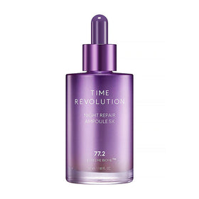 Lilla flaske med teksten "TIME REVOLUTION NIGHT REPAIR AMPOULE 5X" og en dråbeformet hætte.