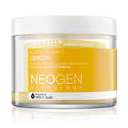 Rund, gennemsigtig beholder med hvide låg og gule gaze pads. Etiket: Neogen Bio-Peel Gauze Peeling Lemon.