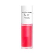 Cylindrisk beholder med hvidt låg, indeholder rød Applecherry Lip Oil. Hydrating & Plumping.