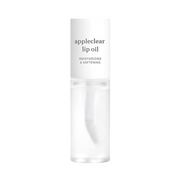 Klar flaske med hvid hætte, mærket "appleclear lip oil" og "moisturizing & softening."