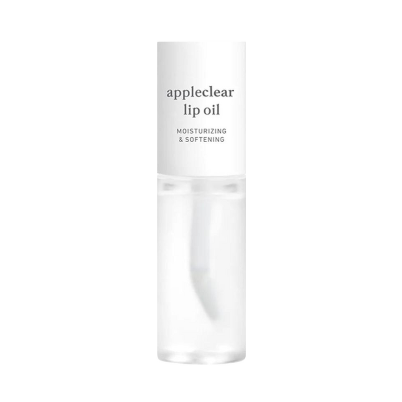 Klar flaske med hvid hætte, mærket "appleclear lip oil" og "moisturizing & softening."