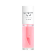 Klar flaske med lyserød lipolie, mærket "applepeony lip oil" og "nourishing & tinting."