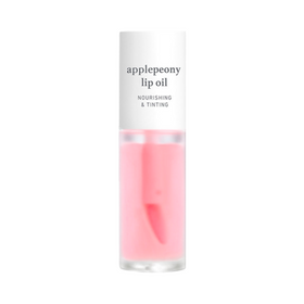 Klar flaske med lyserød lipolie, mærket "applepeony lip oil" og "nourishing & tinting."